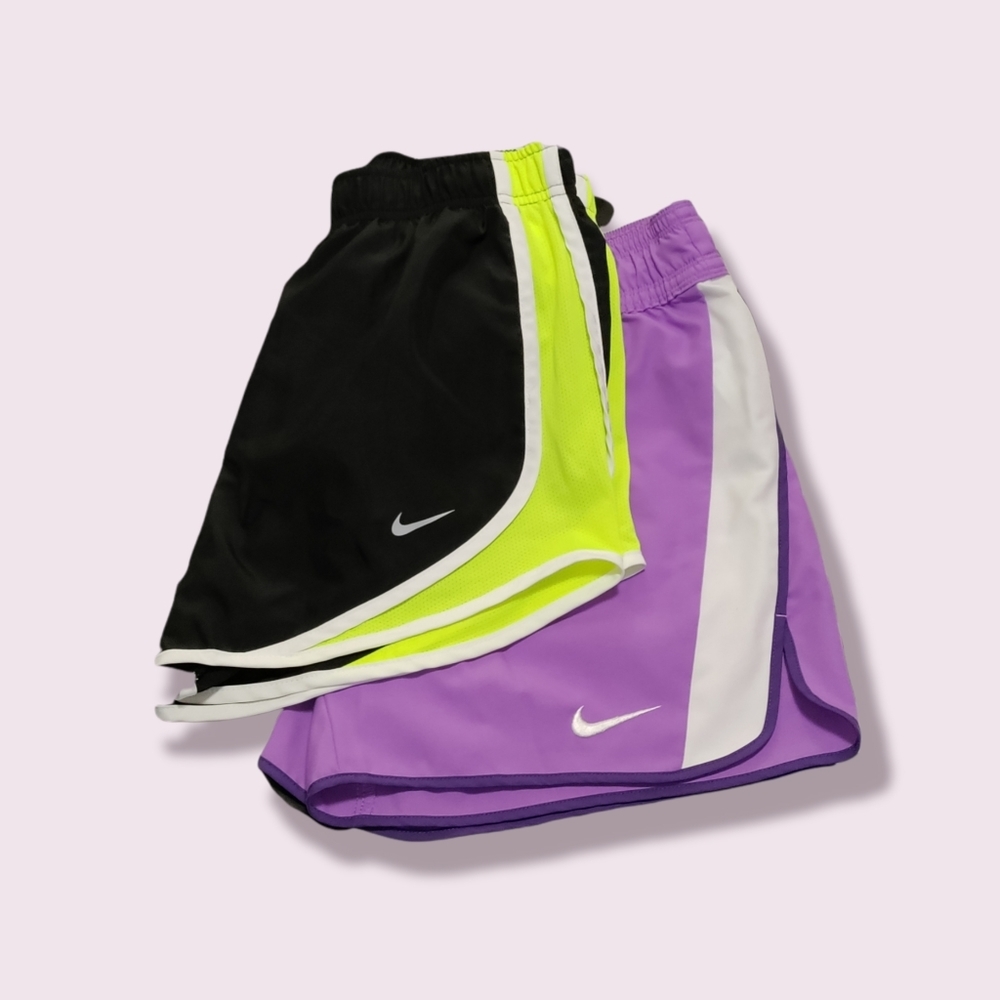 2 pair Nike running shorts! Size small. Black, green, white, and purple.